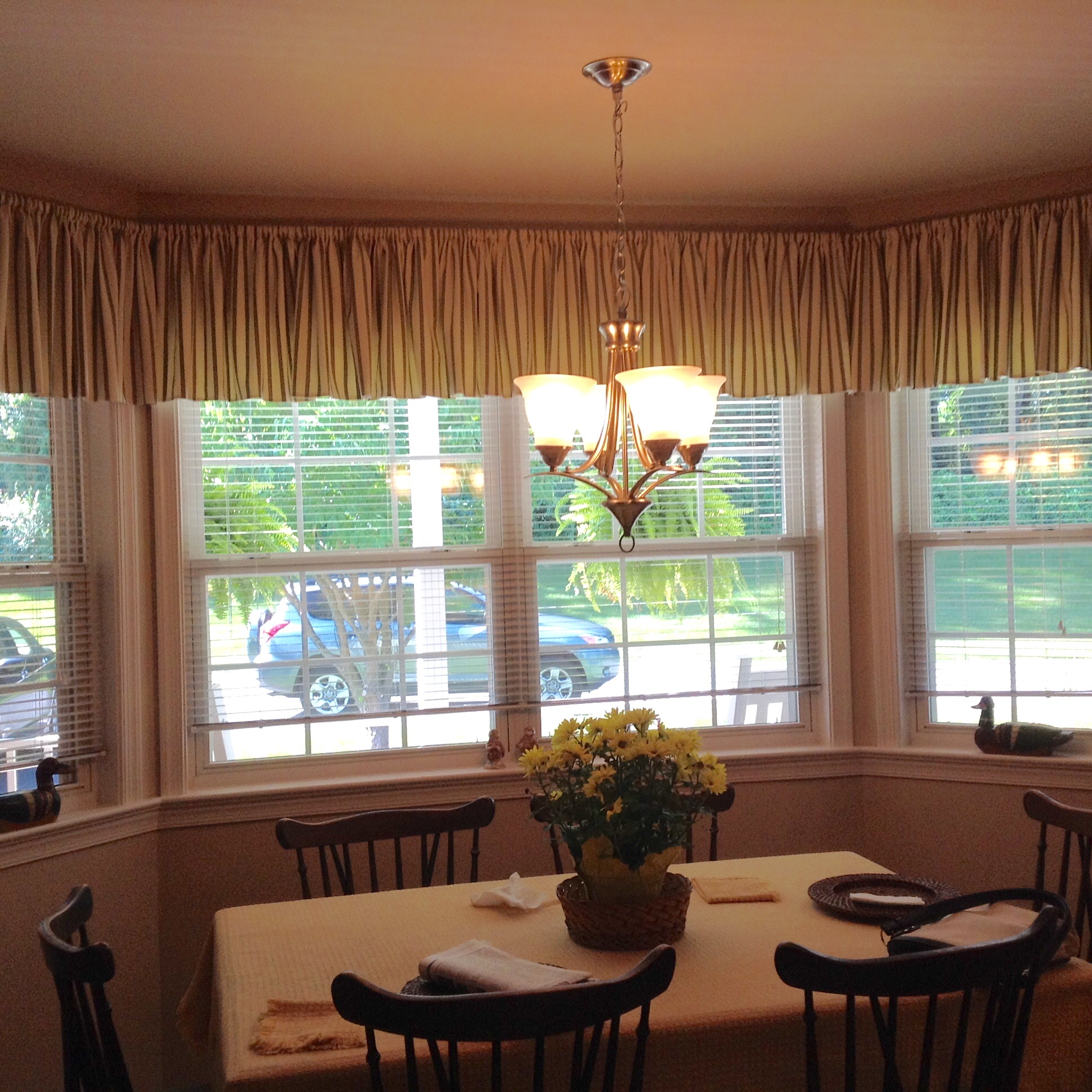 Installation complete in kitchen bay area - notice how the windows look larger by installing several inches above molding